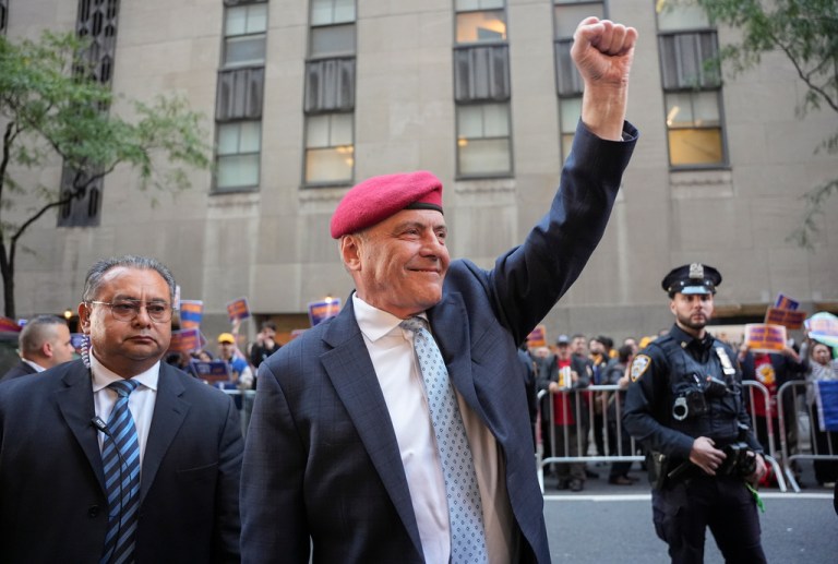 Curtis Sliwa pumps his first as he arrives for the first NYC mayoral debate