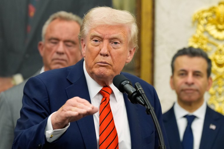Trump speaks in the Oval Office with HHS Secretary RFK Jr. in the background