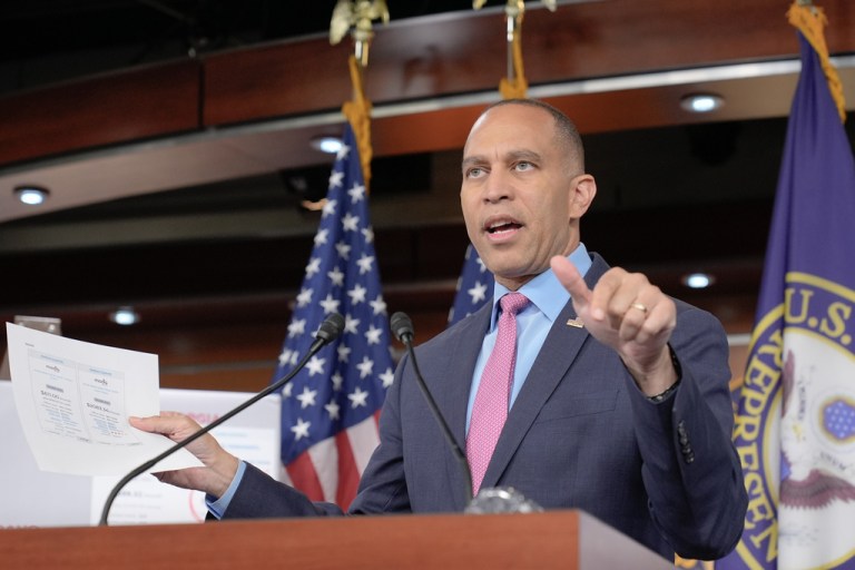 House Minority Leader Hakeem Jeffries (D-NY) speaks to the media behind a podium.