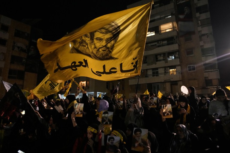 A flag flies honoring a former Hezbollah leader
