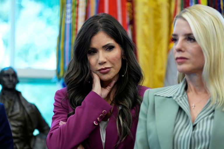 Noem stands next to Pam Bondi in the Oval Office.