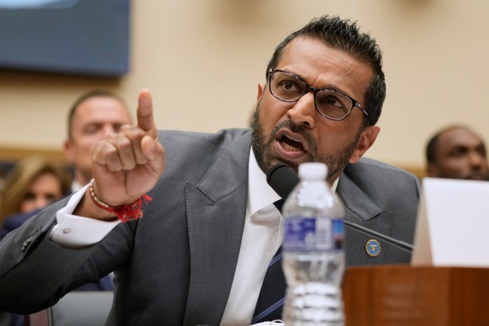 Kash Patel speaks in a hearing and gestures.
