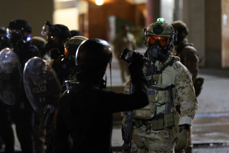 People protest outside a U.S. Immigration and Customs Enforcement facility