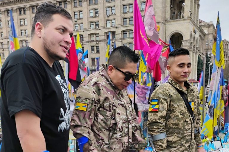 Three Ukrainian soldiers from Colombia in Ukrainian army uniforms.