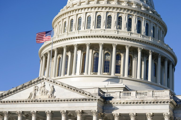 An American flag flies over the Capitol in Washington.