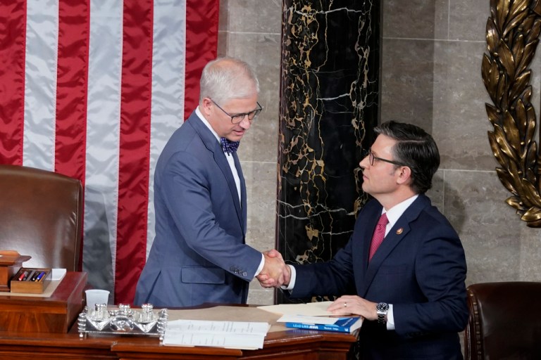 Temporary House speaker Rep. Patrick McHenry( R-NC) talks with Rep. Mike Johnson (R-LA).