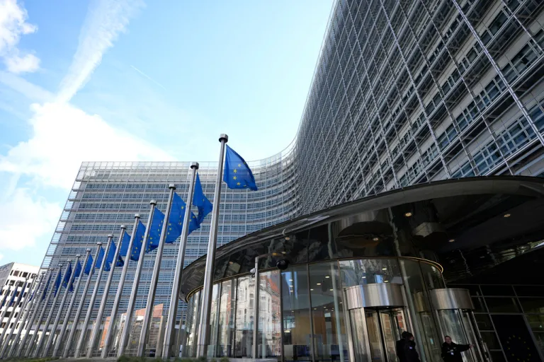 European Union flags fly outside its headquarters in Brussels.