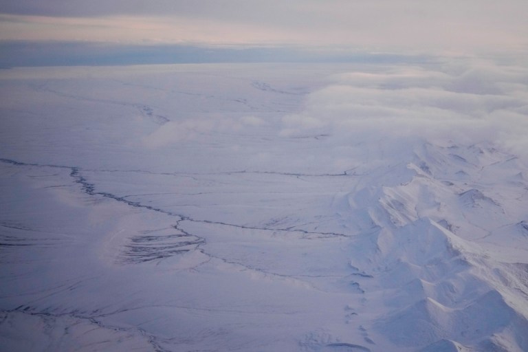 The snow-covered coastal plain area of the Arctic National Wildlife Refuge