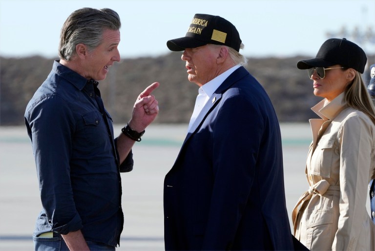 President Donald Trump and first lady Melania Trump listen to California Gov. Gavin Newsom after arriving on Air Force One at Los Angeles International Airport in Los Angeles, Jan. 24, 2025.
