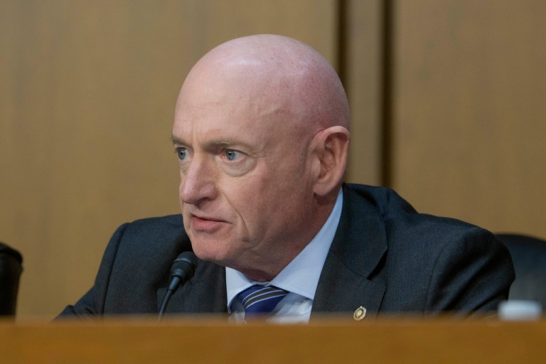 Sen. Mark Kelly, D-Ariz., questions Joseph Kent during a Senate Committee on Intelligence hearing for his pending confirmation to be director of the NCTC, on Capitol Hill, Wednesday, April 9, 2025, in Washington. (AP Photo/Rod Lamkey, Jr.)