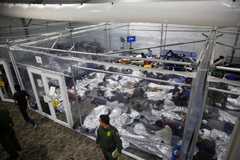 minors lie inside a pod at the Donna Department of Homeland Security holding facility, the main detention center for unaccompanied children.