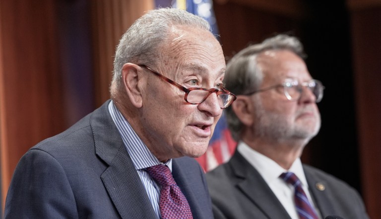 Sen. Minority Leader Chuck Schumer of N.Y., right, speaks about the Epstein files, Wednesday, July 30, 2025, at the Capitol in Washington, as Sen. Gary Peters, D-Mich., looks on. (AP Photo/Mariam Zuhaib)