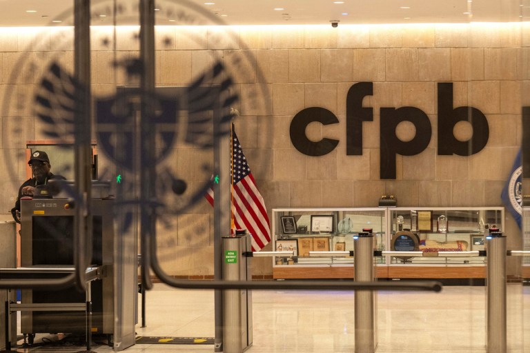 A security officer works inside of the Consumer Financial Protection Bureau's headquarters.