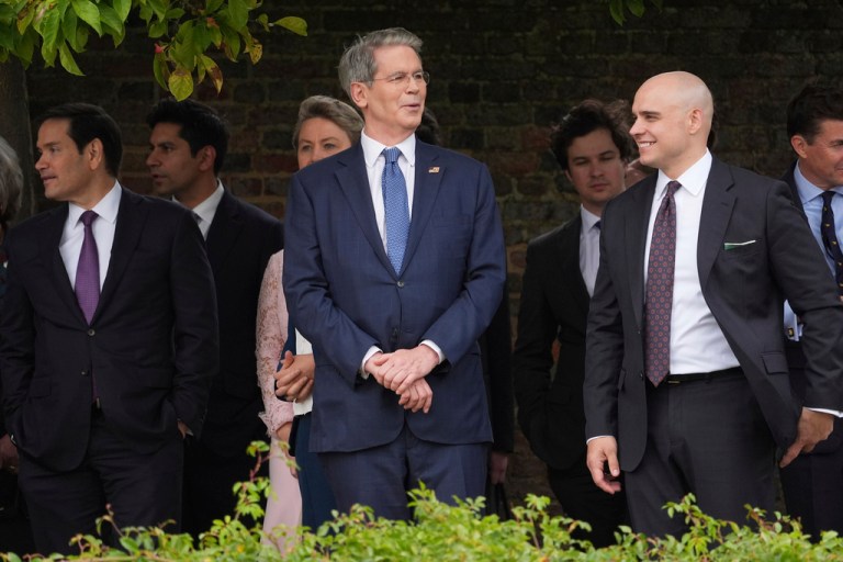 From left, Secretary of State Marco Rubio, Treasury Secretary Scott Bessent and White House Deputy Chief of Staff James Blair wait before a display by the British Parachute Regiment's 