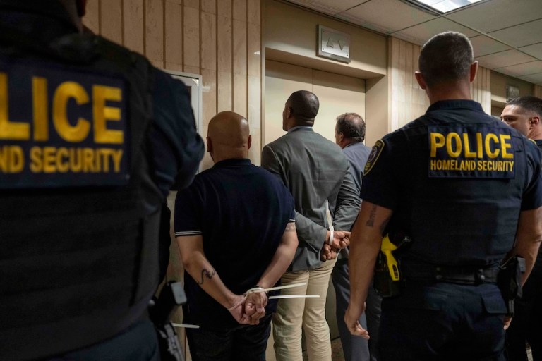 Federal agents detain elected officials.