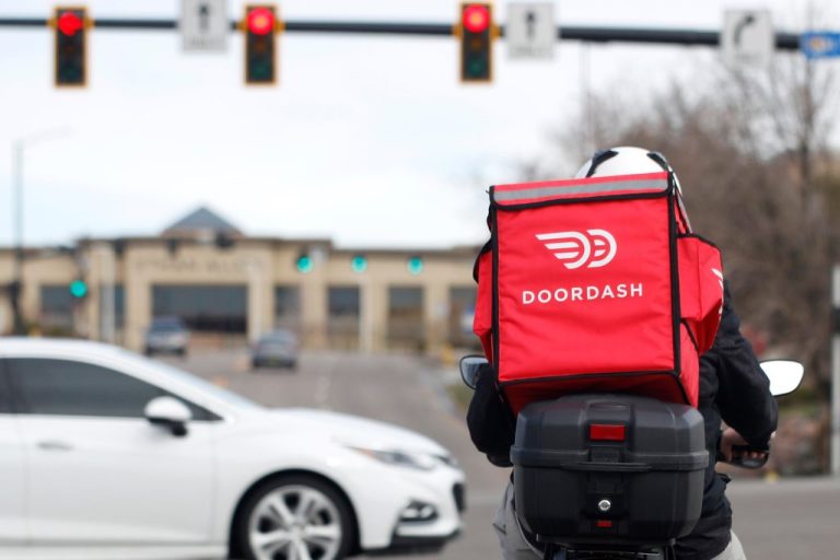 A food delivery stops at a traffic light in Lone Tree, Colorado.