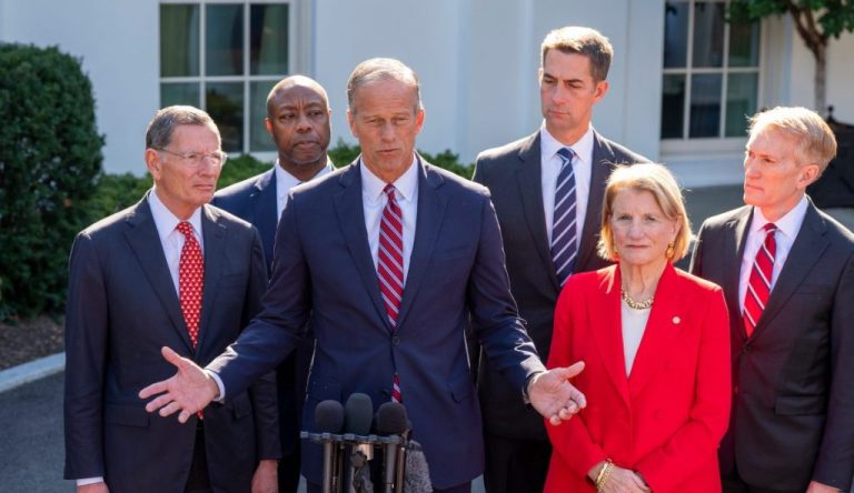 Senate Majority Leader John Thune, of S.D., second from left, and other republican Senate members, speak with reporters after a meeting with President Donald Trump at the White House, Tuesday, Oct. 21, 2025, in Washington. (AP Photo/Alex Brandon)