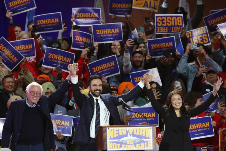 Sen. Bernie Sanders (I-VT), New York City mayoral candidate Zohran Mamdani, center, and Rep. Alexandria Ocasio-Cortez (D-NY) appear onstage during a rally.