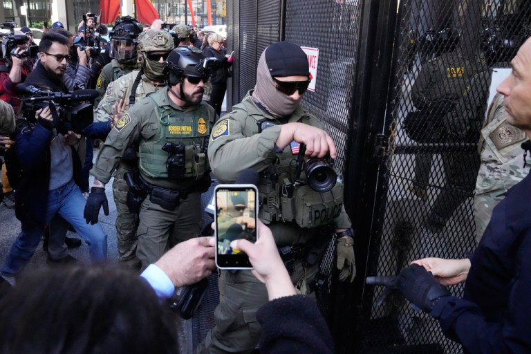U.S. Customs and Border Protection agents arrive to escort U.S. Customs and Border Protection Gregory Bovino from federal court in Chicago, Tuesday, Oct. 28, 2025. (AP Photo/Nam Y. Huh)