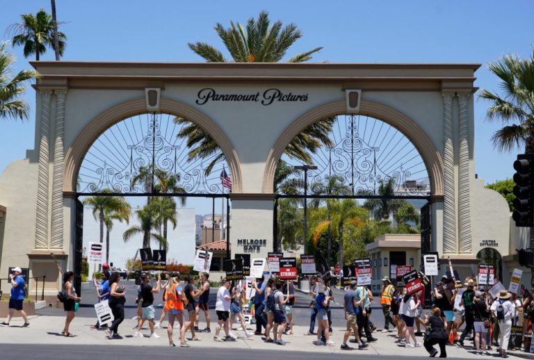 Striking writers and actors take part in a rally outside Paramount studios.