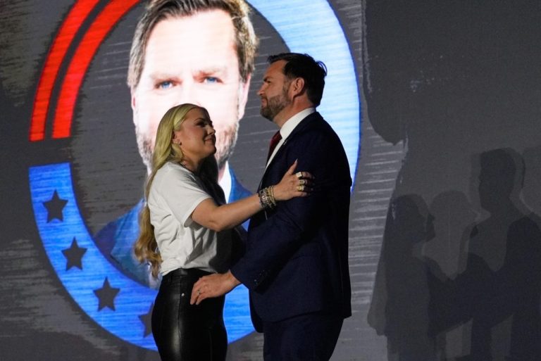 Erika Kirk hugs Vice President JD Vance.