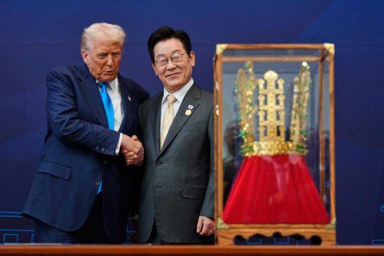 FILE - President Donald Trump shakes hands with South Korean President Lee Jae Myung as he receives a gift of a gold crown and an award of the Grand Order of Mugunghwa, not seen, during a high honor ceremony at the Gyeongju National Museum in Gyeongju, South Korea, Wednesday, Oct. 29, 2025. (AP Photo/Mark Schiefelbein, File)