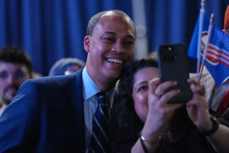Democrat Jay Jones takes a selfie with a supporter at an election night watch party.