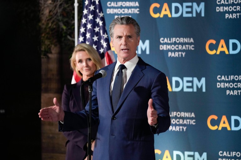 California Gov. Gavin Newsom stands with first partner Jennifer Siebel Newsom as he speaks during an election night press conference at a California Democratic Party office Tuesday, Nov. 4, 2025, in Sacramento, Calif.