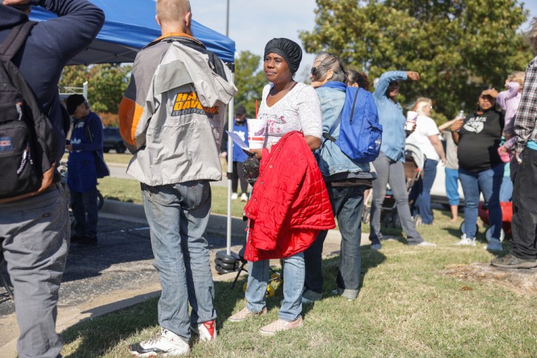 Toddrica Doyle waits in line at a pop-up food distribution event to provide extra support for Tulsa families affected by the recent lapse in SNAP benefits, at Food on the Move in Tulsa, Okla., on Thursday, Nov. 6, 2025. (Mike Simons/Tulsa World via AP)