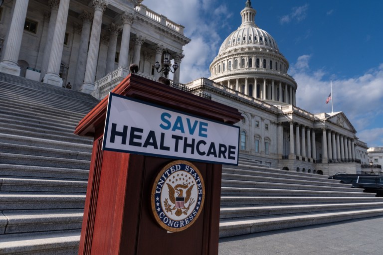 A lectern awaits the arrival of House Democrats to speak on the health care funding fight on the steps of the House before votes to end the government shutdown, at the Capitol in Washington, Wednesday, Nov. 12, 2025
