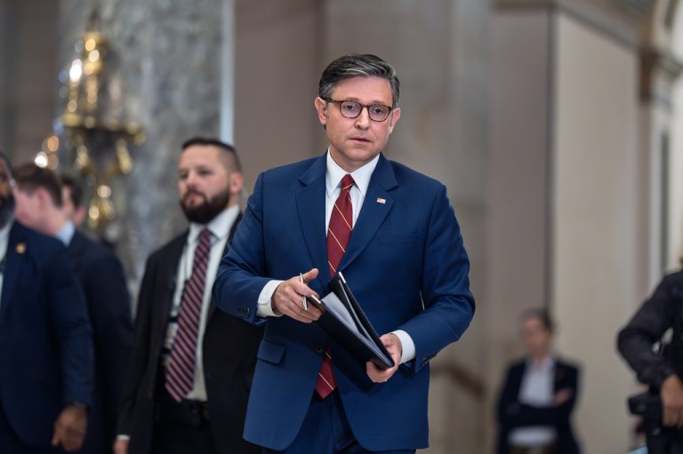 House Speaker Mike Johnson (R-LA) walks from the chamber to speak with reporters.