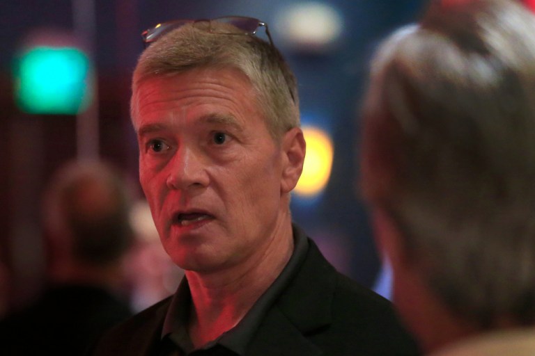 Republican 3rd district congressional candidate Greg Goode talks with supporters at a Johnson County Republican election watch party in Overland Park.