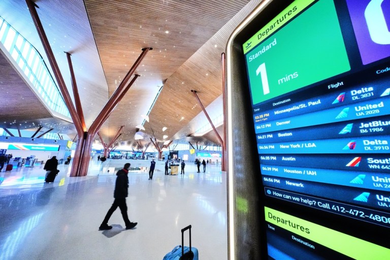 Travelers move through the new $1.7 billion dollar terminal of Pittsburgh International Airport.