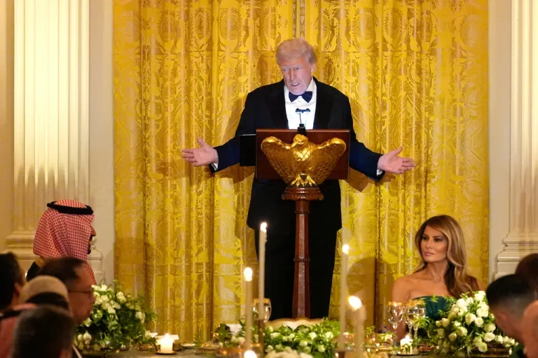 President Donald Trump speaks during a dinner with Saudi Arabia's Crown Prince Mohammed bin Salman in the East Room of the White House, Tuesday, Nov. 18, 2025, in Washington, as first lady Melania Trump watches at right. (AP Photo/Alex Brandon)