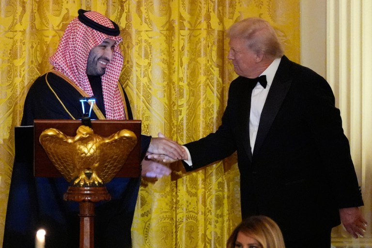 President Donald Trump and Saudi Crown Prince Mohammed bin Salman shake hands.