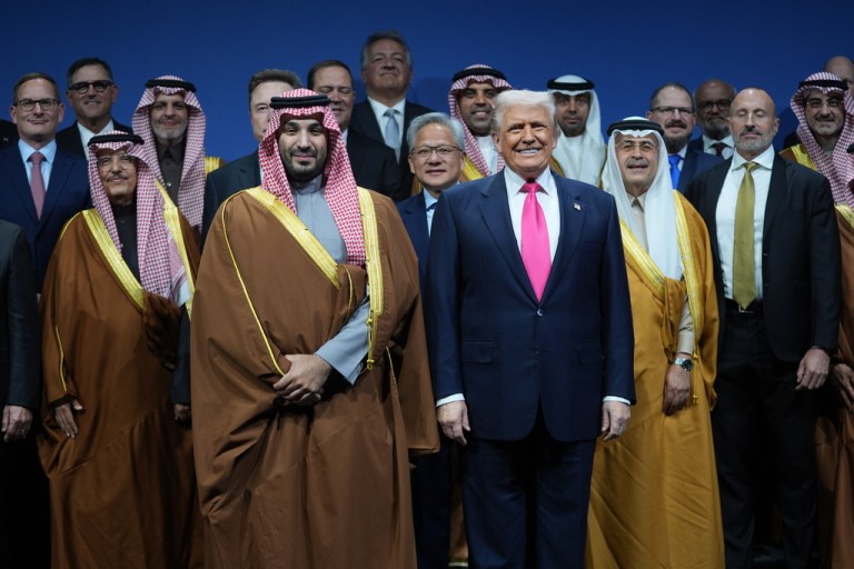 President Donald Trump stands with Saudi Crown Prince Mohammed bin Salman.