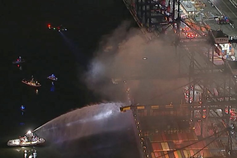 First responders fight fire on a container ship in LA