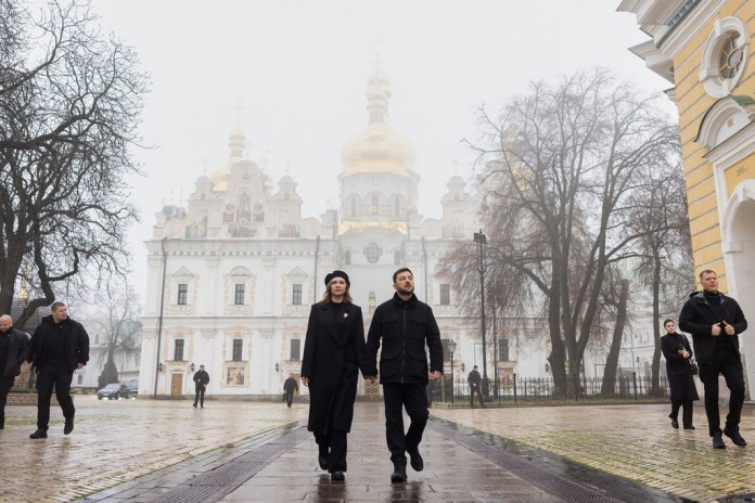 In this photo provided by the Ukrainian Presidential Press Office, Ukrainian President Volodymyr Zelenskyy and his wife Olena walk after commemorative ceremony for victims of the Holodomor, Great Famine, that killed millions in the 1930's, in Kyiv, Ukraine, Saturday, Nov. 22, 2025.