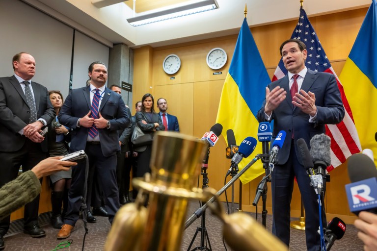 U.S. Secretary of State Marco Rubio, right, talks to the press at the U.S. Mission to International Organizations in Geneva, Switzerland, Sunday, Nov. 23, 2025.