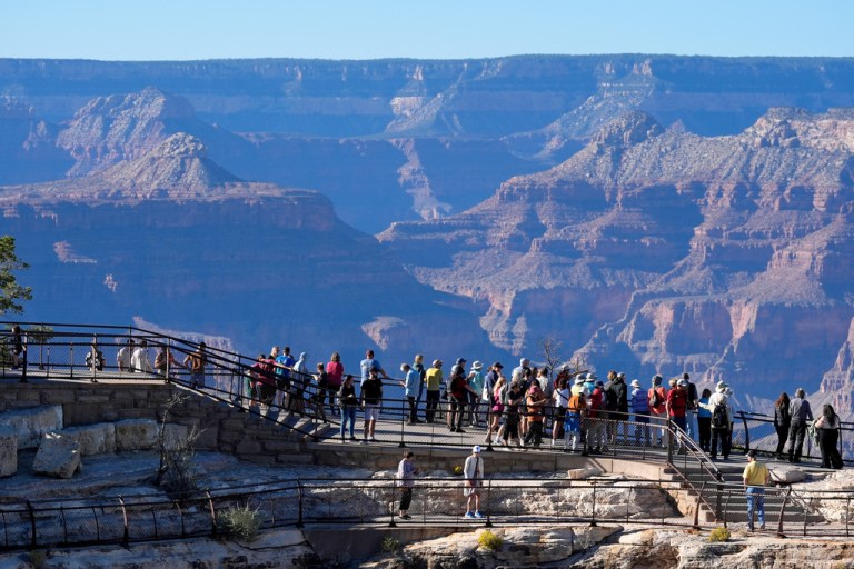 Tourists flock to Mather Point at Grand Canyon National Park.