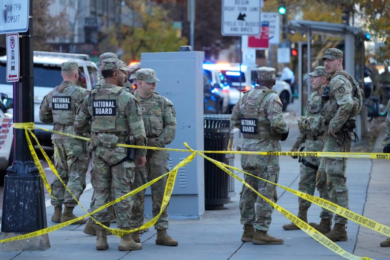 Members of the National Guard gather after reports of two National Guard soliders were shot near the White House in Washington, Wednesday, Nov. 26, 2025. (AP Photo/Mark Schiefelbein)