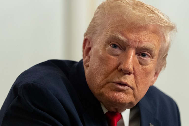President Donald Trump speaks to reporters after speaking to troops via video from his Mar-a-Lago estate on Thanksgiving, Thursday, Nov. 27, 2025, in Palm Beach, Fla. (AP Photo/Alex Brandon)