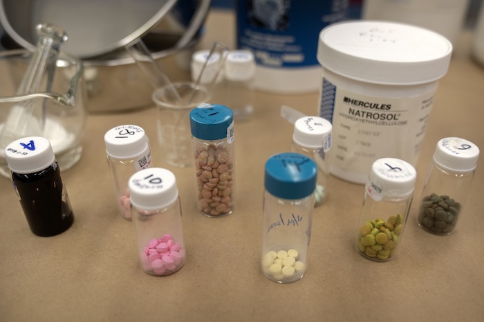 Containers of fentanyl pills at a Drug Enforcement Administration research laboratory.