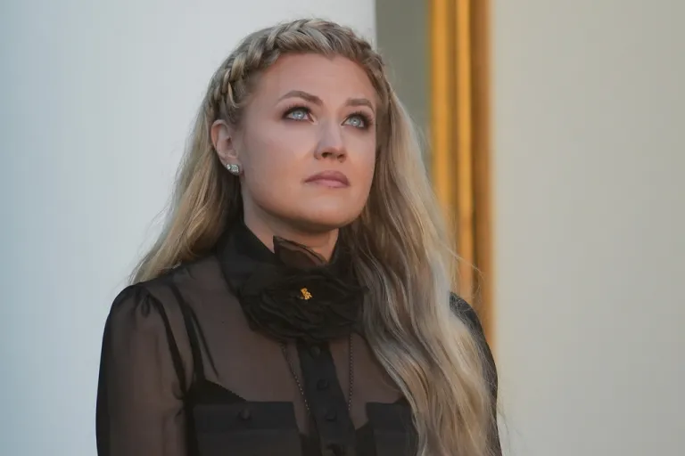 Erika Kirk listens as a military aide reads the citation before President Donald Trump posthumously awards the Presidential Medal of Freedom to Charlie Kirk.