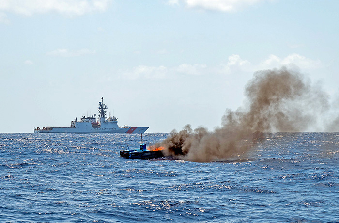 A speedboat described by Trump administration officials as smuggling drugs to the U.S. burns following an attack at sea, Sept. 2, 2025.