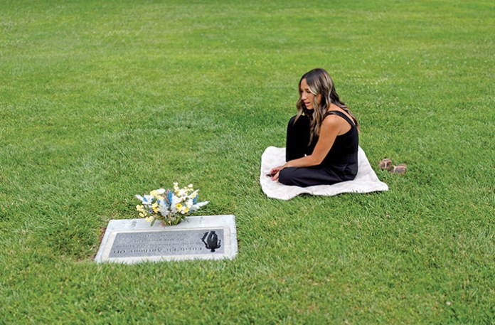 Mikayla Brown at the grave of her son, Elijah, who died of a fentanyl overdose at age 15, in Paso Robles, California, Aug. 2, 2024. (Jae C. Hong / AP)