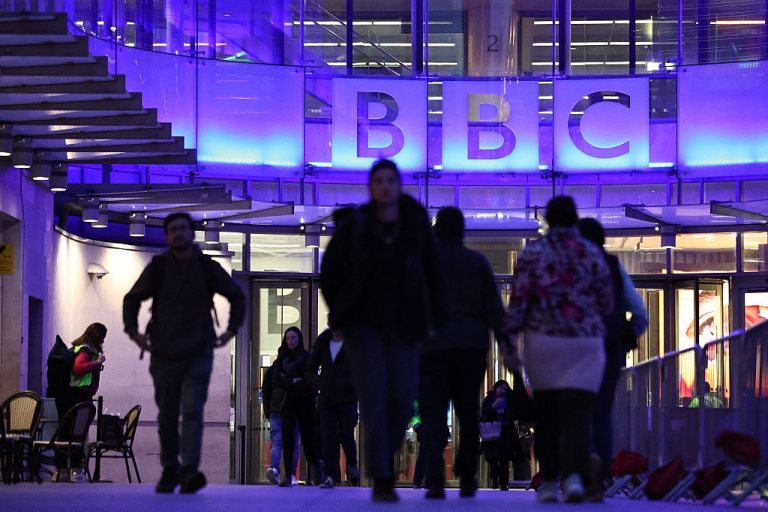 People enter the offices of British broadcaster BBC in London.