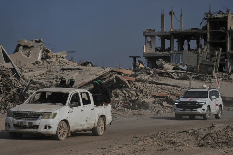 4 of 6 | Hamas militants accompanied by members of the International Committee of the Red Cross (ICRC) head to east of Gaza City to search for the bodies of hostages, Thursday, Nov. 13, 2025. (AP Photo/Jehand Alshrafi)