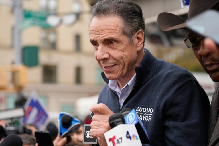 Andrew Cuomo talks to voters the day before the general election.