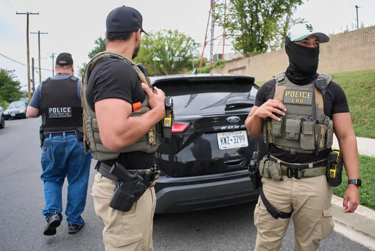 Federal agents regroup before heading out on an operation.